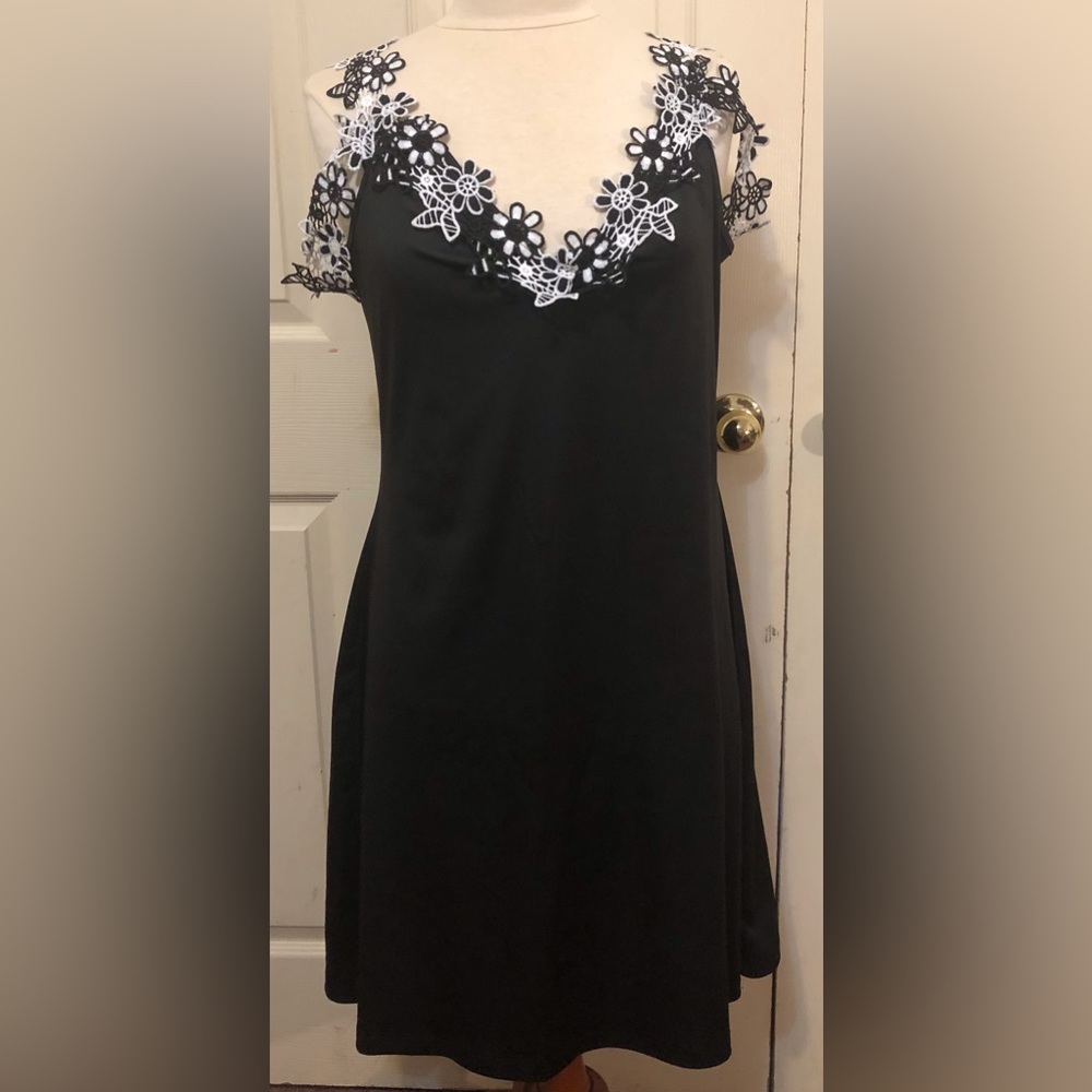 Black Vneck dress with floral appliqué neck line and arms size large